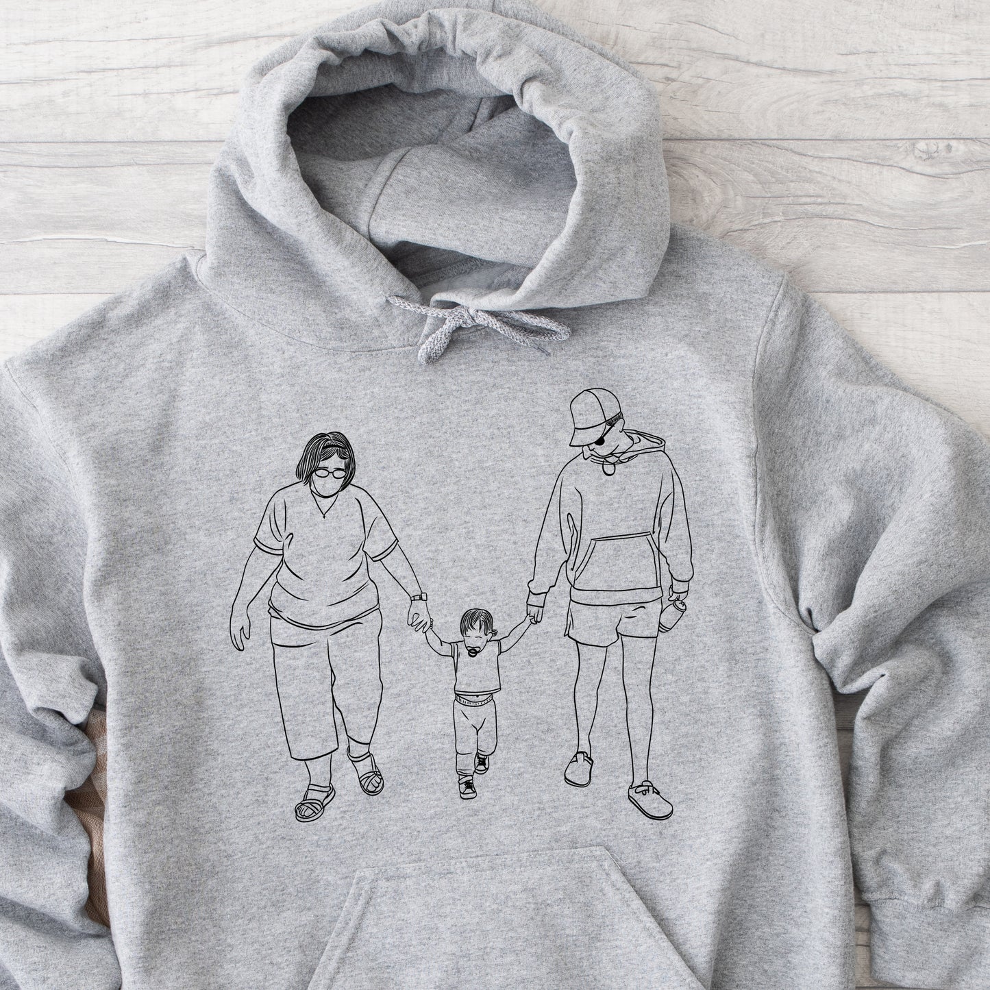 Custom faceless portrait hoodie, personalized Christmas gift sweatshirt for family or couple.
Personalized hoodie with family illustration, cozy holiday gift idea for mom or partner.